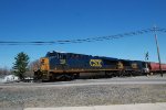 CSX 908 takes an intermodel through town.